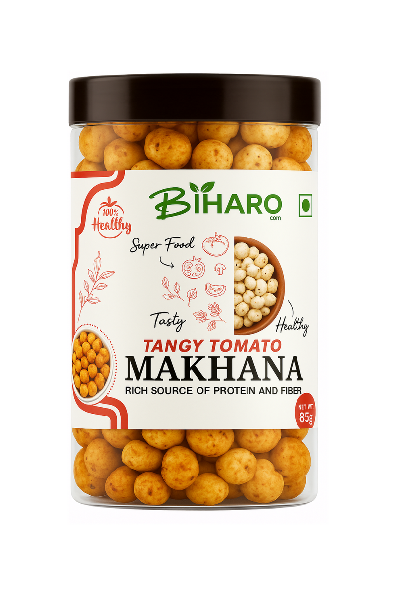 A transparent plastic jar with a dark brown lid containing round, golden-brown Tangy Tomato Makhana snacks. The front label features the brand name “BIHARO.com” with green leaf accents, red tomato illustrations, and text reading “100% Healthy,” “Super Food,” “Tasty,” and “Rich Source of Protein and Fiber.” A small image shows plain makhana in a bowl, and another shows seasoned makhana. The label also states the net weight as 85g